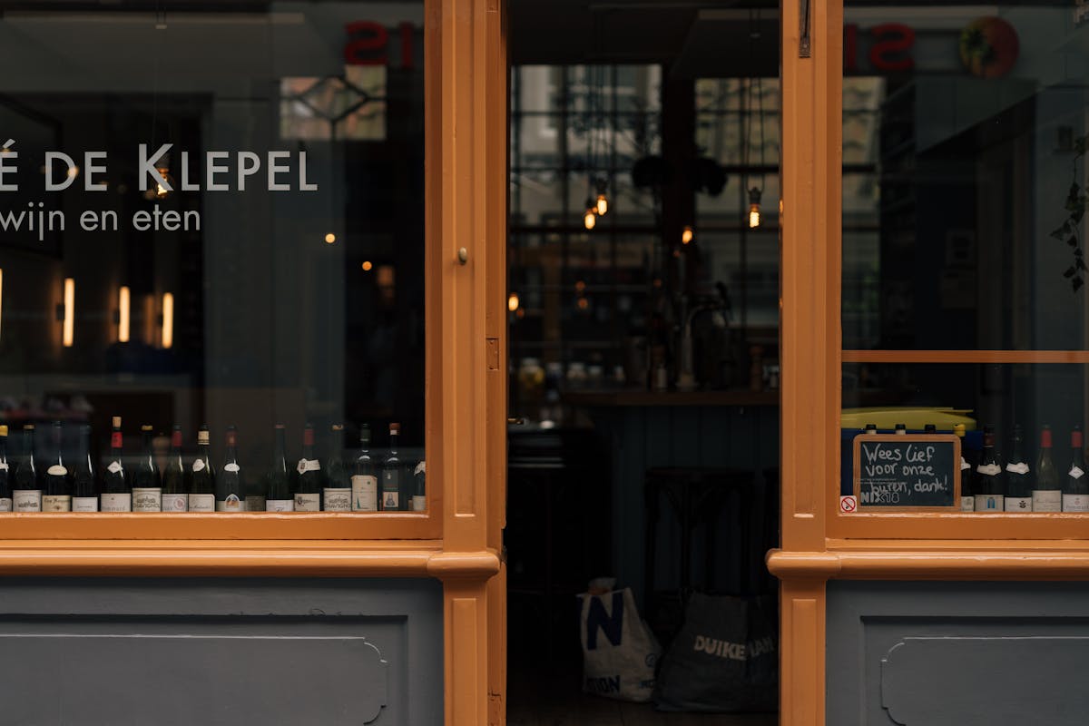 Cozy wine bar storefront in Amsterdam